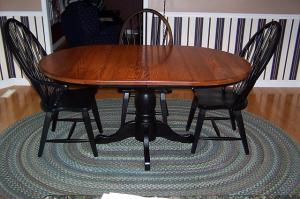 round oak table 4 black chairs